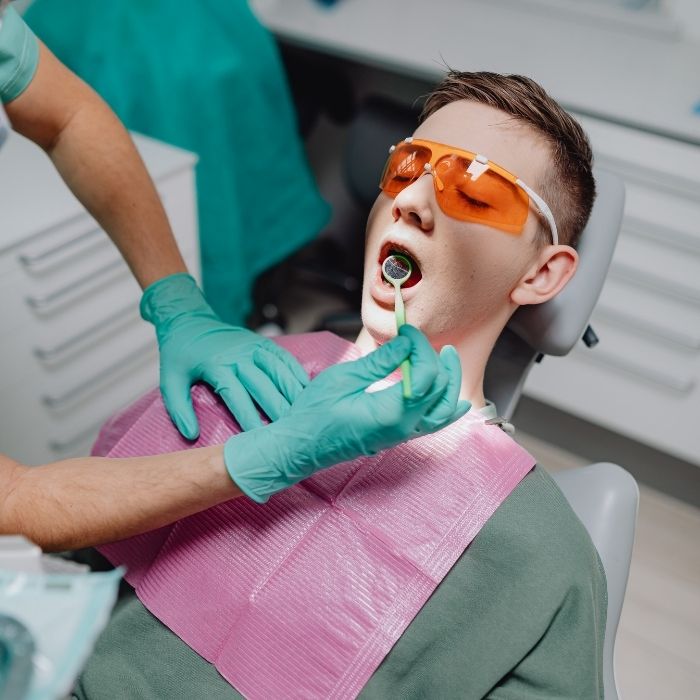A teen at the dentist