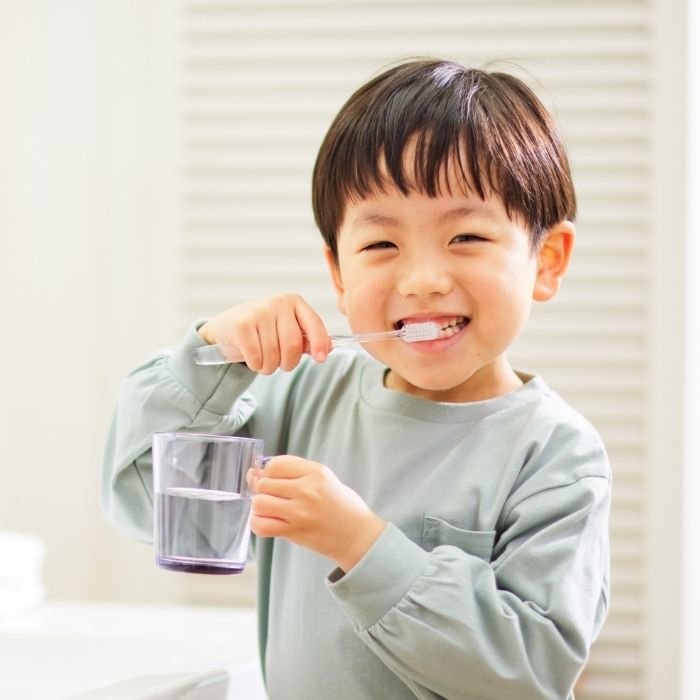 A child brushing his teeth